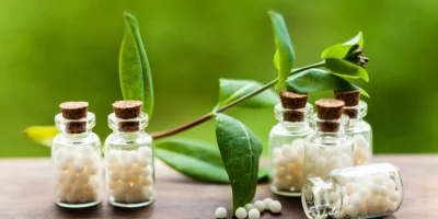 classical-homeopathy-globules-vintage-bottles-nature-leaves
